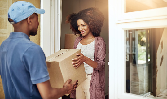 Courier delivering packages to a customer in Jamaica